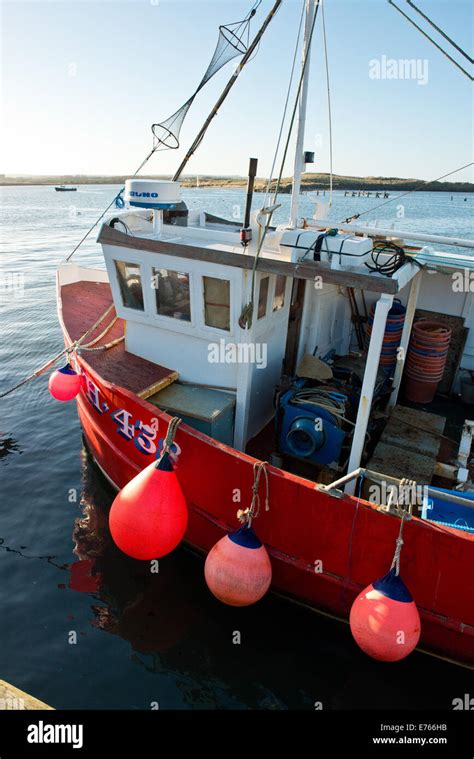 Small North Sea fishing trawler moored in Amble, Northumberland, England, UK Stock Photo - Alamy