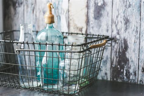 Vintage empty bottles in metal basket · Free Stock Photo