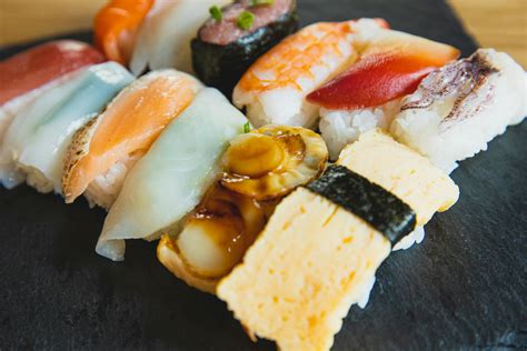 Traditional Japanese sushi covered with raw fish · Free Stock Photo