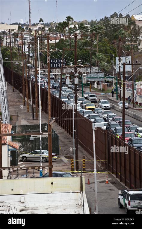 Border fence and backed up traffic crossing from Mexicali, Mexico Stock Photo: 55829175 - Alamy