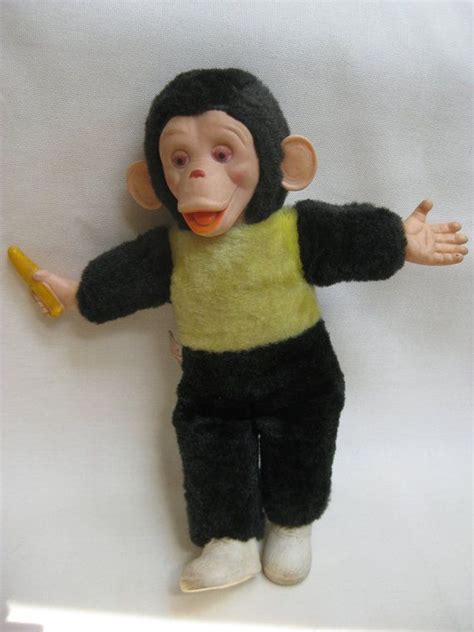 Old Stuffed Monkey With Banana In Hand - Banana Poster