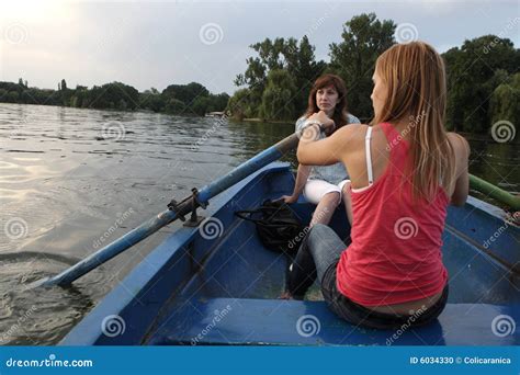 Girls rowing a boat stock photo. Image of back, happy - 6034330