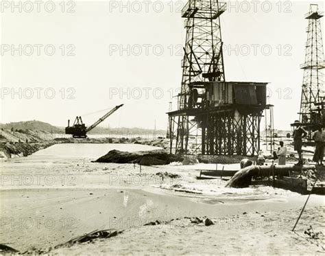 Raising the land at the Chauk-Lanywa oilfield. Construction workers use a dredge. - Photo12 ...