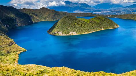 Panorama of Cuicocha blue lagoon inside the crater of Cotacachi volcano ...