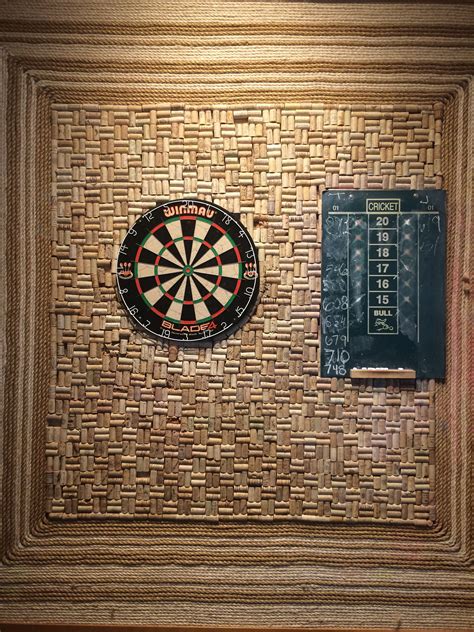 Cork wall behind dart board … | Dart board, Wine cork, Wine cork board