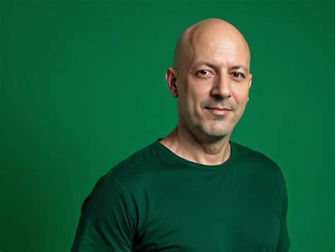 Confident 40YearOld Bald Man Posing Against Green Background | MUSE AI