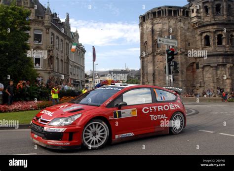 French Sebastien Loeb and co-pilot Daniel Elena of Citroen C4 WRC pass ...