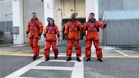 Artemis 2 crew walks out of historic NASA building in launch dress ...