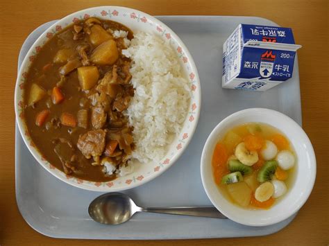 Curry and rice, a common school lunch in Japan. Comes with a milk and some fruit salad ...