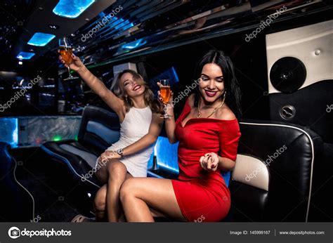 Girls partying in limousine Stock Photo by ©oneinchpunch 145999167