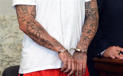 Officials examining Aaron Hernandez's tattoos for gang ties - CBSSports.com