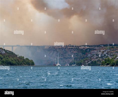 Forest fire in Croatia, summer natural disaster close to national park Krka, Sibenik region ...