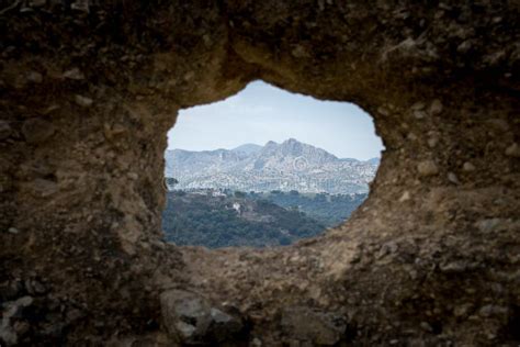 A View through a Hole in the Wall Stock Image - Image of garden, fullframe: 84870165