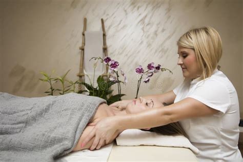 Young Woman Relaxing during Shoulder Body Massage at Spa Stock Photo ...