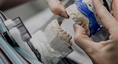 stock-photo-dental-technician-working-with-tooth-dentures-at-prosthesis ...