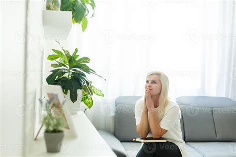 woman praying with bible 17027177 Stock Photo at Vecteezy