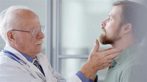 Experienced Doctor Examining Neck Checking Stock Footage SBV-335005930 - Storyblocks