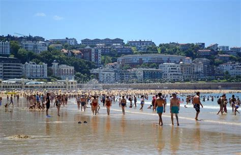 Holiday-makers Walking Along the Coastline La Concha Beach Editorial ...