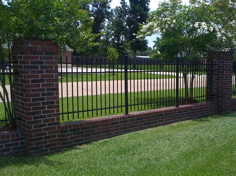 Wrought iron fencing with brick border. | Wrought iron fencing ...