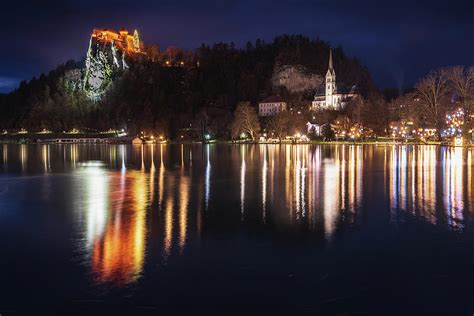 Slovenia, Bled Lake, Bled Castle and town by night Photograph by Nicola Simeoni - Pixels