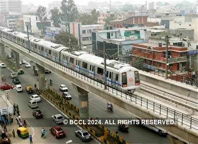 A metro train leaves the Sector-15 station in Noida on the inaugural ...