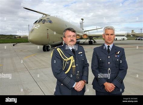 Group Captain Chris Birks, Base Commander at RAF Kinloss, Scotland in front of a Nimrod aircraft ...