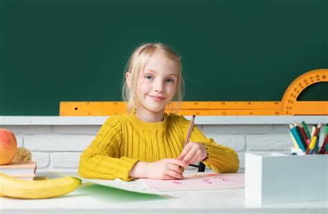 Premium Photo | School girl studying math on lesson in classroom at elementary school Education ...