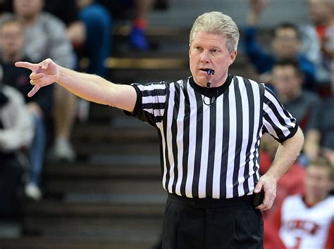 Referee on His Cell Phone During Basketball Game