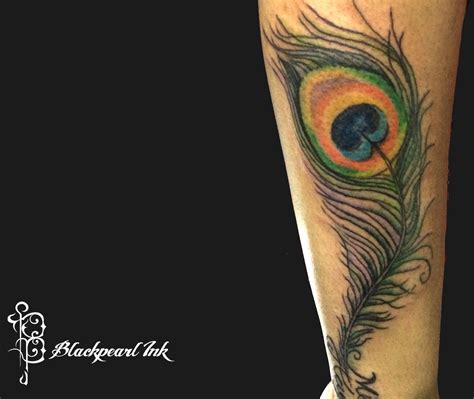 Realistic peacock feather tattoos that will blow your mind