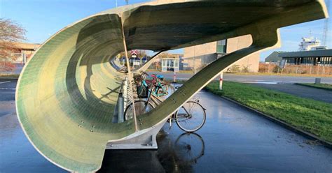 denmark is repurposing discarded wind turbine blades as bike shelters