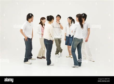 Young people standing in circle Stock Photo - Alamy