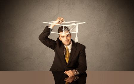 An elegant, successful university student drawing himself a square academic mortarboard cap with ...