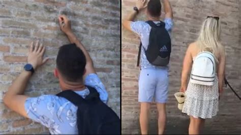 Tourist branded 'a**hole' after he's caught 'carving girlfriend's name' into Rome's Colosseum