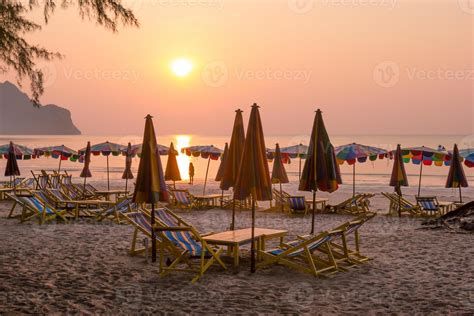 beach chairs with golden sunset 10734507 Stock Photo at Vecteezy