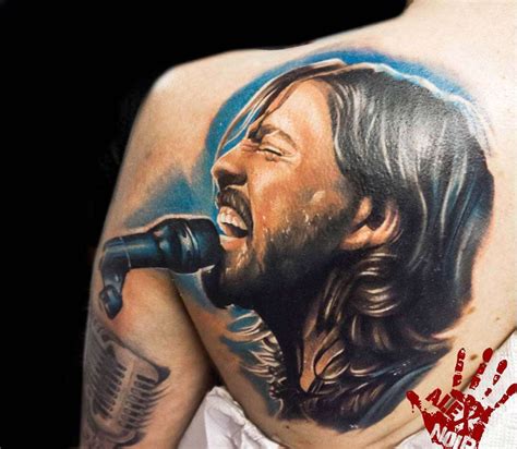 Dave Grohl Tattoos - Dave Grohl Ditches His Shirt To Show Off Muscular ...