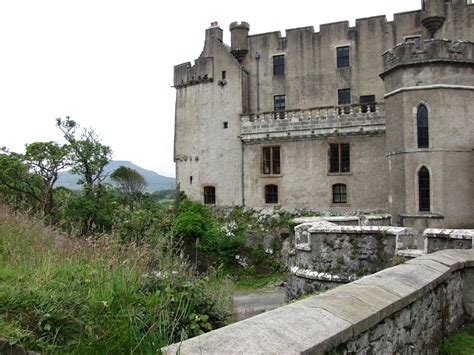 an old castle with stone walls and windows