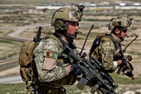 Afghan National Army Commandos running to a compound during a live ...