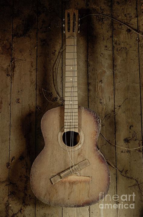 An old guitar Photograph by Benny Woodoo - Fine Art America