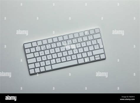 Top view of white computer keyboard on grey background Stock Photo - Alamy