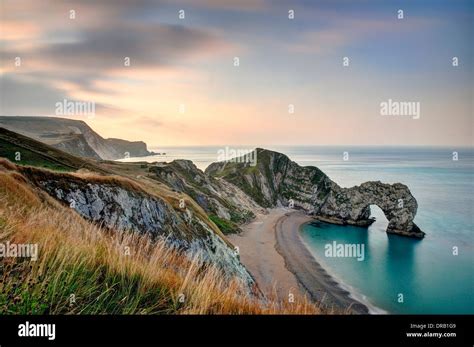 Durdle Door at sunrise Stock Photo - Alamy