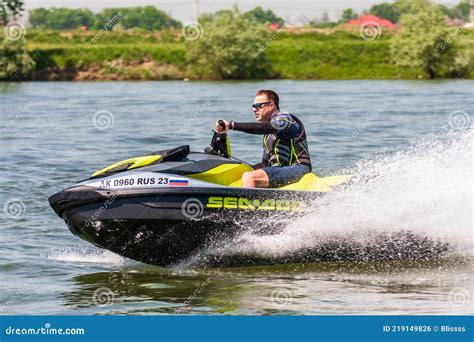 Happy BRP Sea-Doo Jet Ski Driver Drives Watercraft Splashing Outdoor at ...