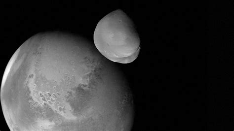 'Unprecedented' images of Martian moon Deimos sent from space probe ...