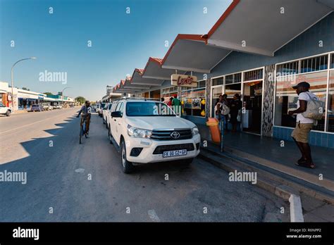 NAMIBIA, TSUMEB, MAY 12: Ordinary people on typical african street with shops in city Tsumeb ...