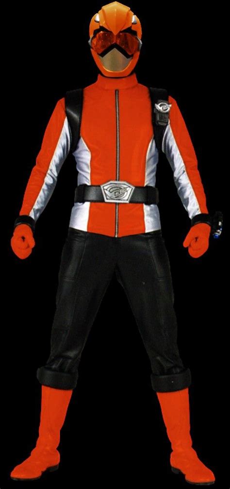 a man in an orange and black costume with goggles on his head, standing