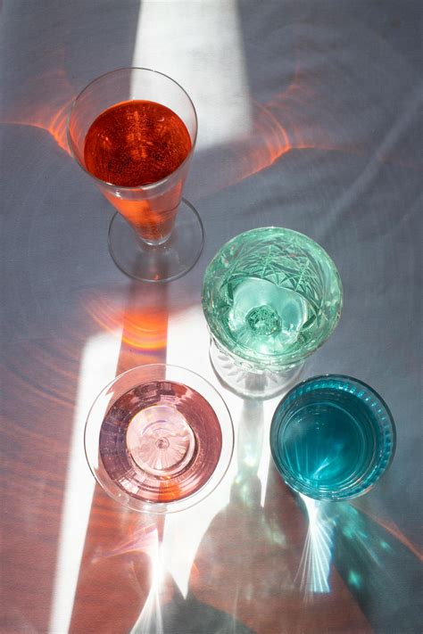 Drinks in transparent glasses lightened by sun · Free Stock Photo