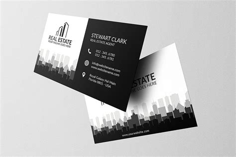 two black and white business cards with cityscape in the background, both on top of each other