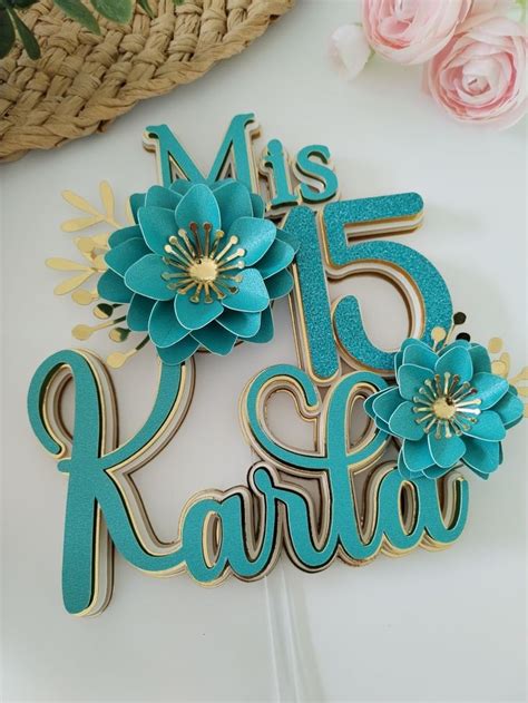 a cake topper with flowers and the number 25 in it's name is shown