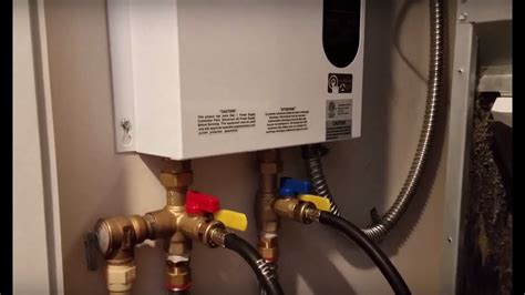 Flushing out a tankless water heater to clean and descale - YouTube