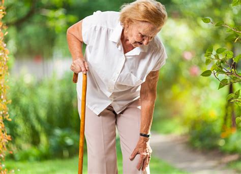 Elderly Woman With A Walking Stick Stock Photo - Download Image Now - iStock