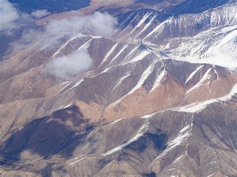 Aerial View Of The Snowy Mountains During The Day Background And ...